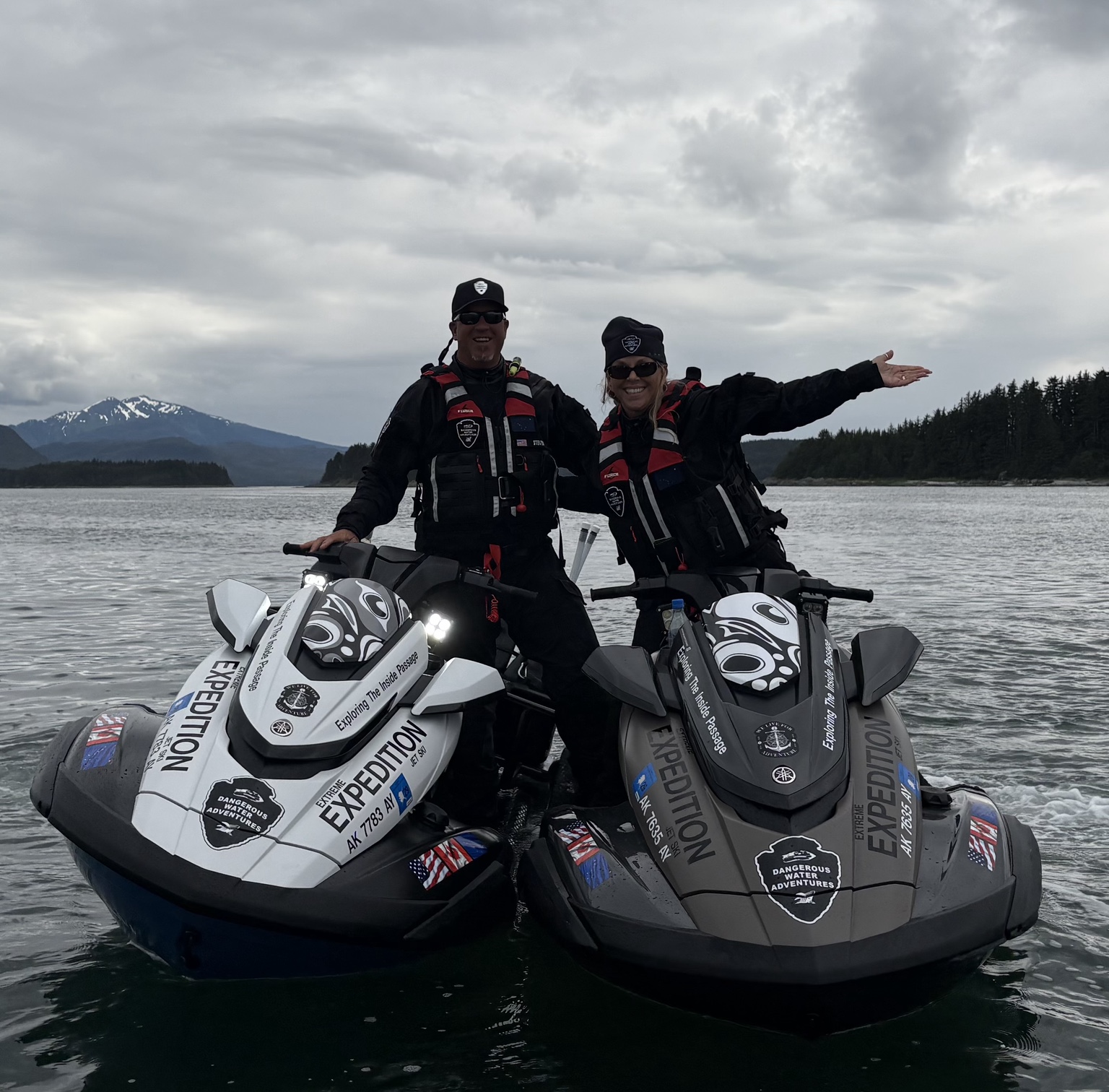 Guests posing with jet skis